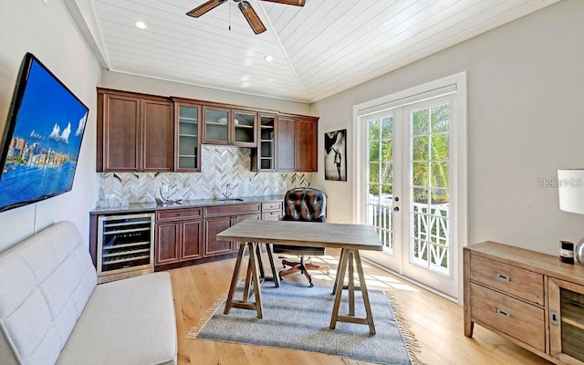 bar with lofted ceiling, wine cooler, light hardwood / wood-style flooring, tasteful backsplash, and wood ceiling