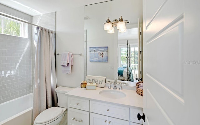 full bathroom with vanity, toilet, and shower / bath combo with shower curtain