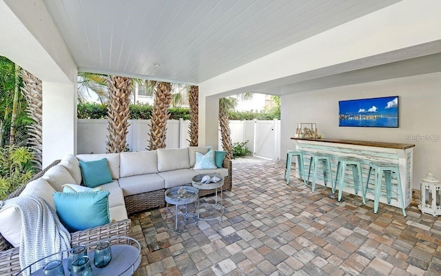 view of patio / terrace featuring outdoor lounge area and a bar