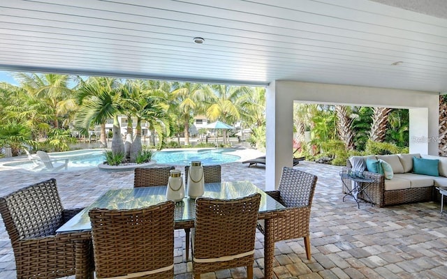 view of patio / terrace with pool water feature and an outdoor hangout area