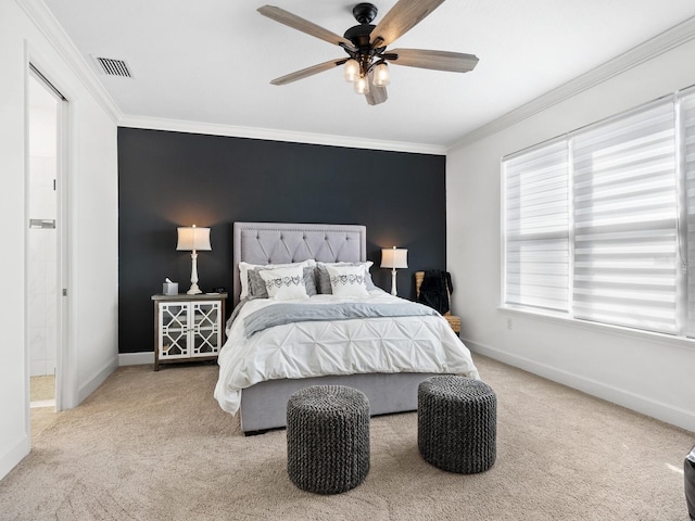 carpeted bedroom with ceiling fan and crown molding