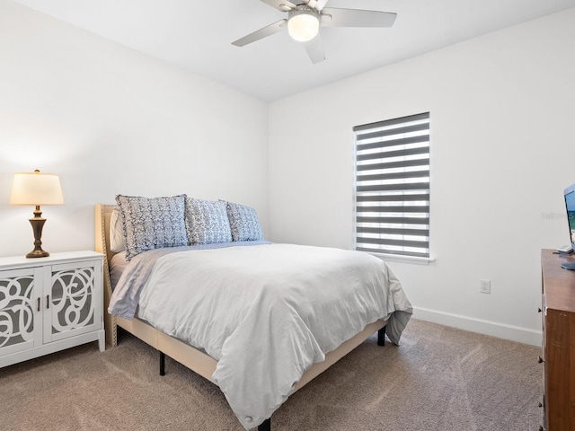 bedroom with ceiling fan and carpet floors