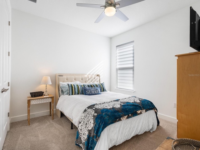 bedroom with light colored carpet and ceiling fan