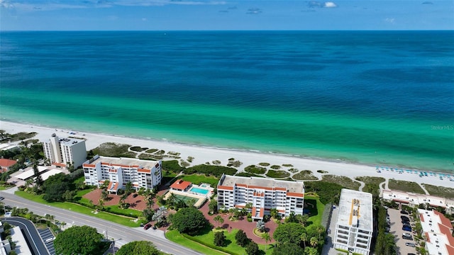 aerial view with a water view and a view of the beach