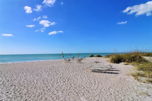 property view of water featuring a beach view