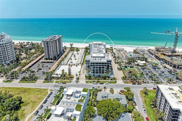 aerial view featuring a water view and a beach view