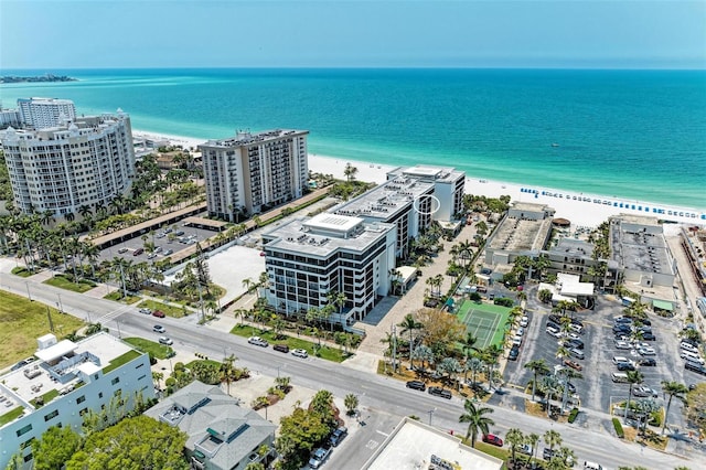 drone / aerial view featuring a view of the beach and a water view