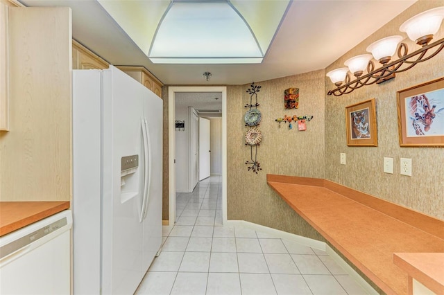 hall featuring light tile patterned floors