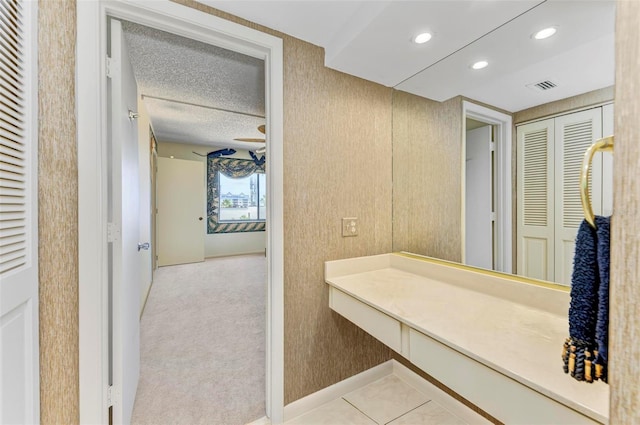 bathroom featuring a textured ceiling