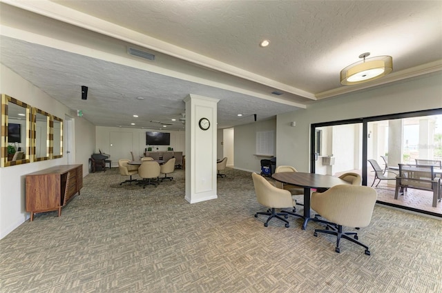 dining area featuring carpet and a textured ceiling