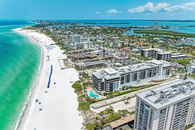 bird's eye view with a water view and a view of the beach