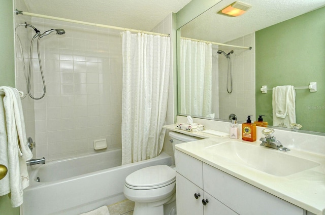 full bathroom with vanity, toilet, shower / bath combo with shower curtain, and a textured ceiling