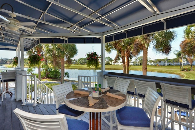 wooden terrace featuring a gazebo and a water view