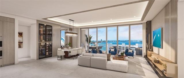 living room featuring a tray ceiling and a notable chandelier