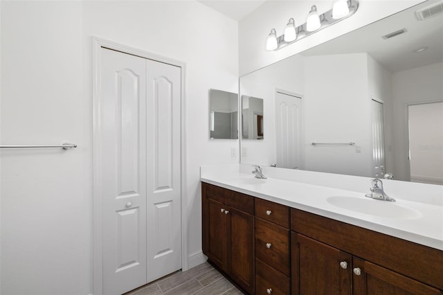 bathroom featuring hardwood / wood-style flooring and vanity