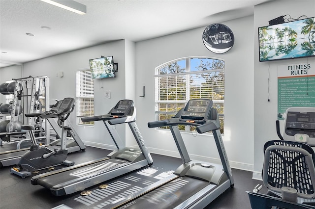 workout area with a textured ceiling