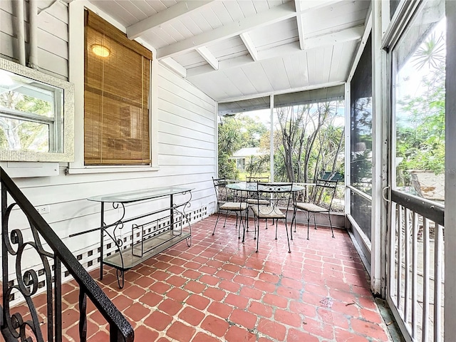 sunroom / solarium featuring wood ceiling