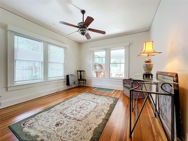 sitting room featuring hardwood / wood-style flooring and ceiling fan