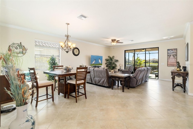 6517 Willowshire Way, Bradenton, FL 34212 - dining room featuring ornamental molding, light tile patterned flooring, a ceiling fan, a chandelier, and baseboards
