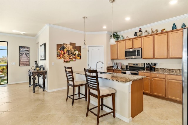 6517 Willowshire Way, Bradenton, FL 34212 - kitchen featuring stainless steel appliances, a sink, a breakfast bar area, dark stone counters, and a kitchen island with sink