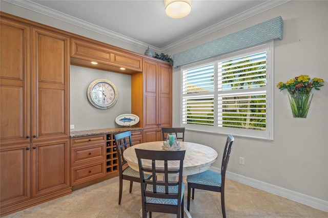 dining space featuring light tile patterned floors and ornamental molding