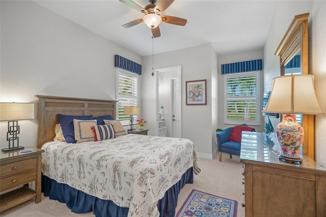 bedroom featuring ceiling fan and light carpet