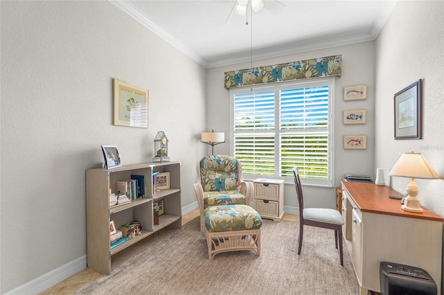 sitting room with ceiling fan and ornamental molding