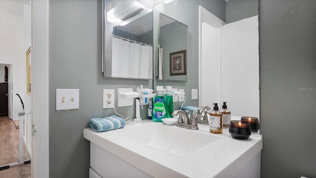 bathroom featuring vanity and wood-type flooring