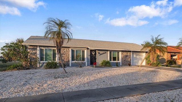 single story home featuring a garage