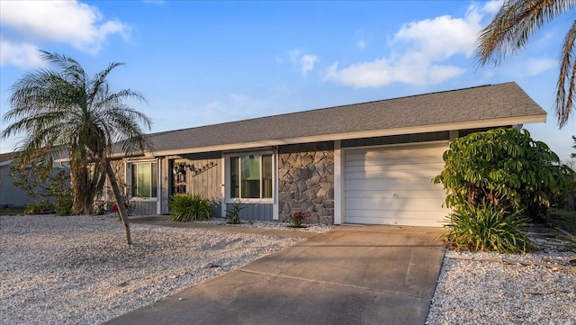 ranch-style house featuring a garage