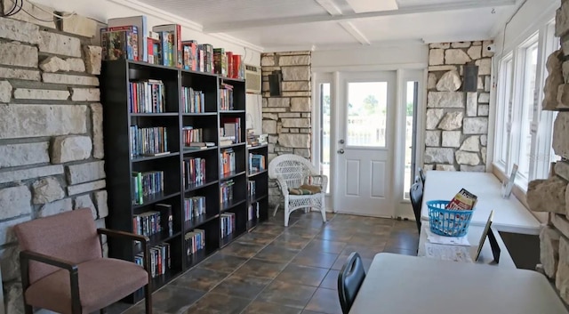 living area with beam ceiling