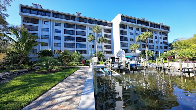 5911 Midnight Pass Rd Unit 504, Sarasota, FL 34242 - dock area with boat lift and a water view