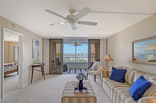 carpeted living room featuring ceiling fan