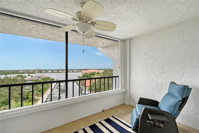 5911 Midnight Pass Rd Unit 504, Sarasota, FL 34242 - balcony featuring a ceiling fan and a water view