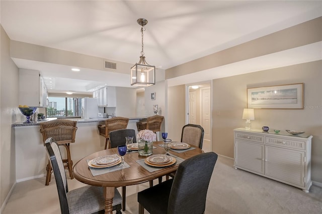 view of carpeted dining space