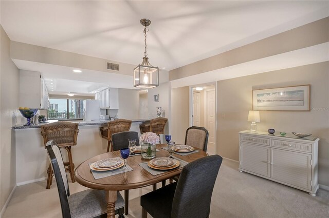 5911 Midnight Pass Rd Unit 504, Sarasota, FL 34242 - dining area featuring light carpet and baseboards