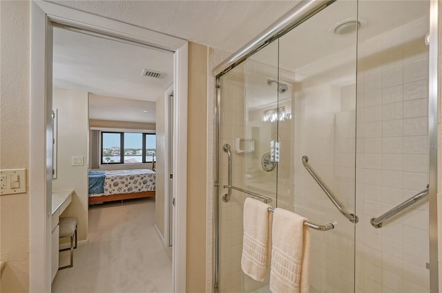 bathroom with a shower with shower door