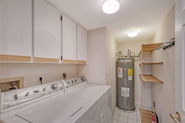 5911 Midnight Pass Rd Unit 504, Sarasota, FL 34242 - washroom with water heater, cabinet space, washing machine and clothes dryer, and light tile patterned floors