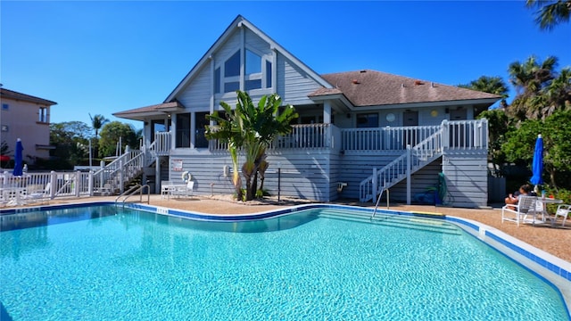 5911 Midnight Pass Rd Unit 504, Sarasota, FL 34242 - community pool featuring stairway, a deck, and a patio