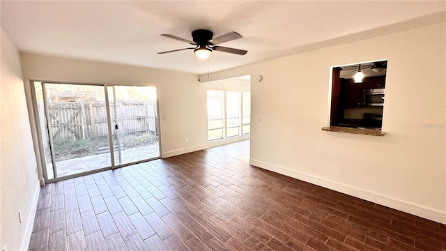 empty room featuring dark hardwood / wood-style floors and ceiling fan