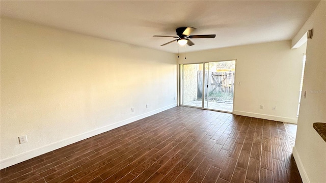 unfurnished room with ceiling fan and dark wood-type flooring