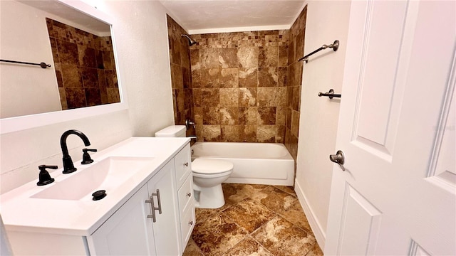 full bathroom featuring vanity, toilet, and tiled shower / bath