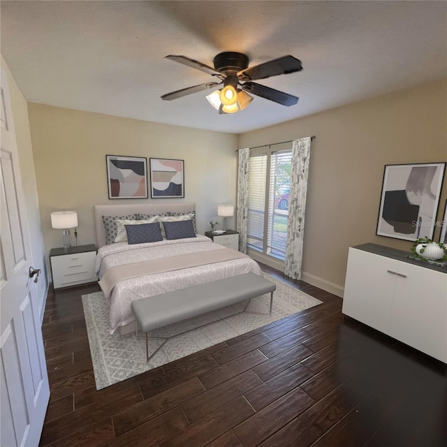 bedroom with ceiling fan and dark hardwood / wood-style flooring