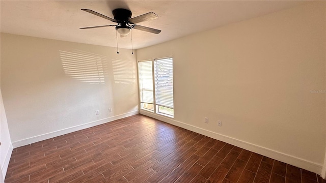 spare room featuring ceiling fan and dark hardwood / wood-style flooring