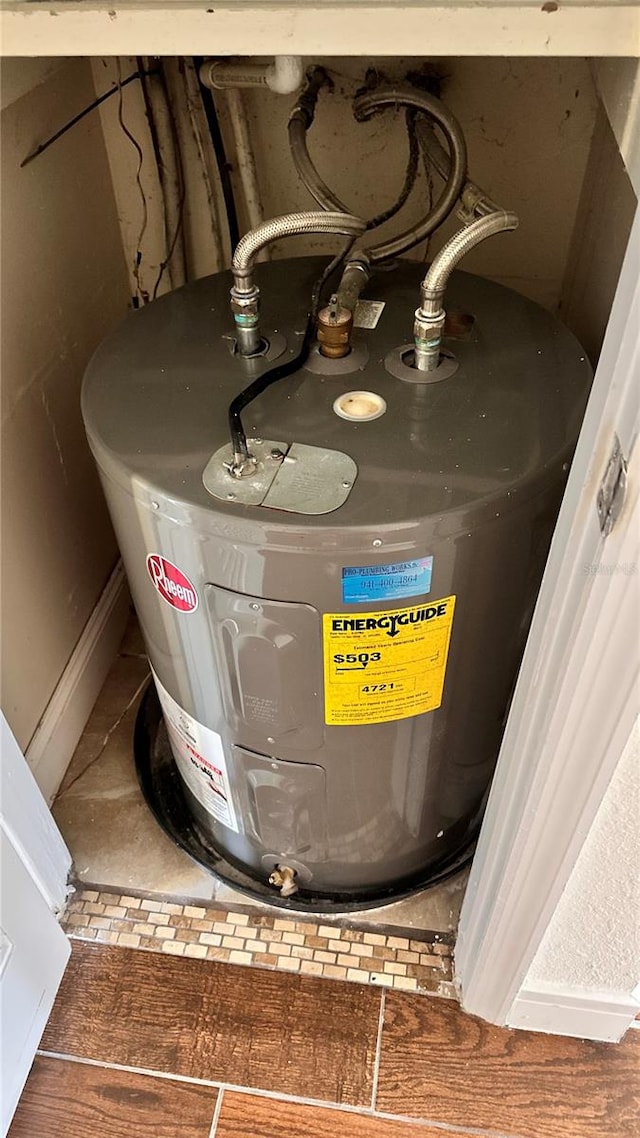 utility room with electric water heater