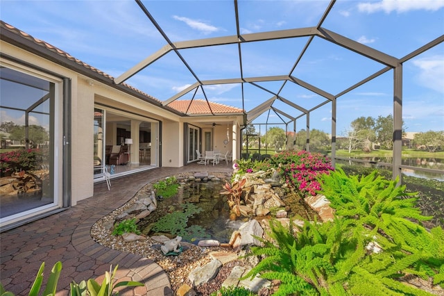 exterior space featuring a lanai and ceiling fan