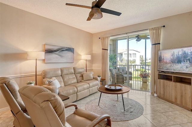 living room with light tile patterned floors and a textured ceiling