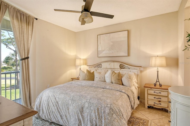 bedroom with multiple windows, ceiling fan, and light tile patterned floors