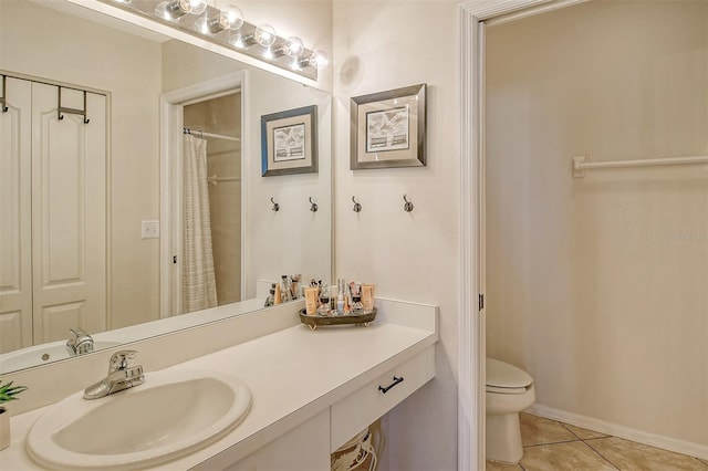 bathroom featuring tile patterned floors, a shower with curtain, vanity, and toilet