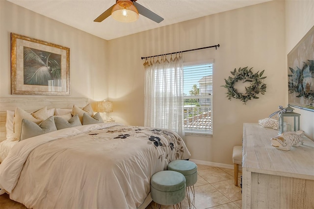 bedroom with ceiling fan and light tile patterned floors